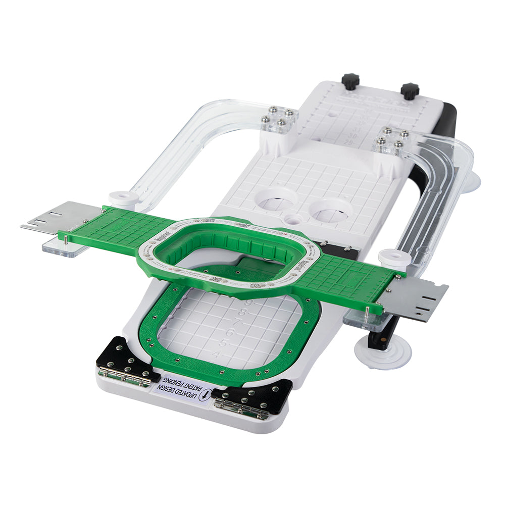 Green 3.9-inch magnetic embroidery hoop positioned on the flat hooping board